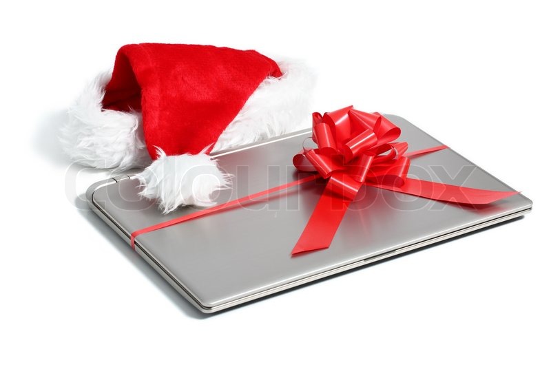 laptop computer christmas gift with a ribbon isolated on a laptop computer christmas gift with a ribbon isolated on a
