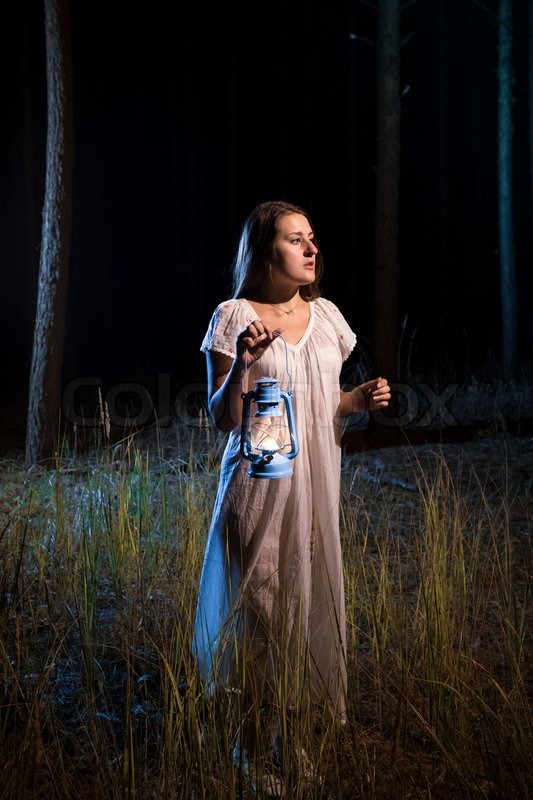 Lonely lost woman in forest at night ... | Stock image | Colourbox