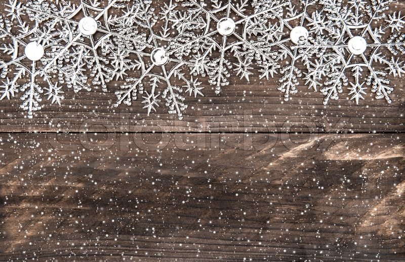 christmas decoration snowflakes with snowfall effect over merry christmas burlap garland
