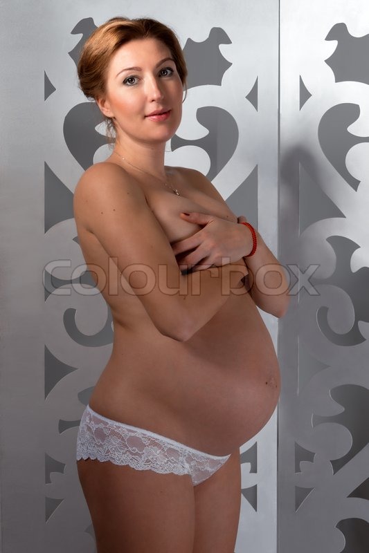 Nudist Naturist Pregnant - Young beautiful nude pregnant woman on a white background. | Stock image |  Colourbox