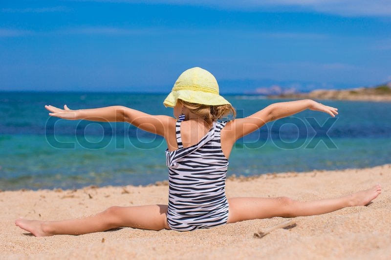 Adorable little girl making legsplit Stock image Colourbox