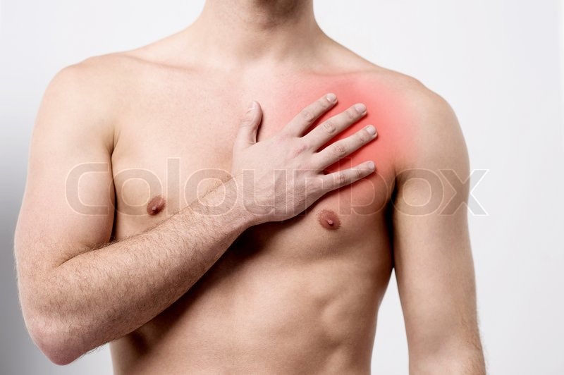 Male suffering pain on his chest muscle | Stock Photo | Colourbox