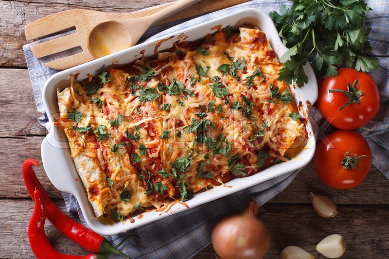 Mexican enchilada in a baking dish with Stock image Colourbox