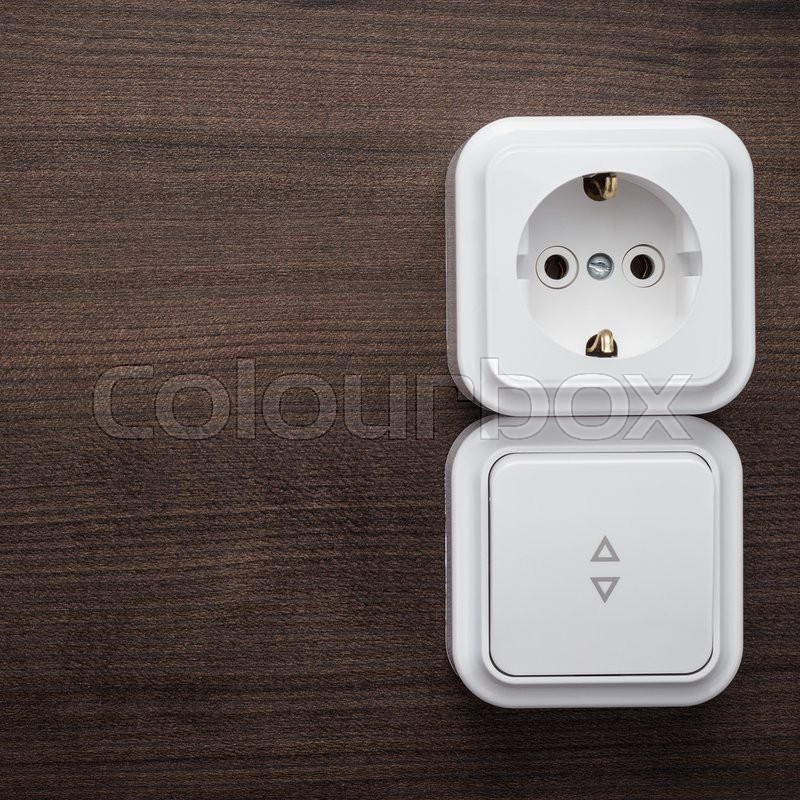 Light switch and outlet on the wall | Stock image | Colourbox