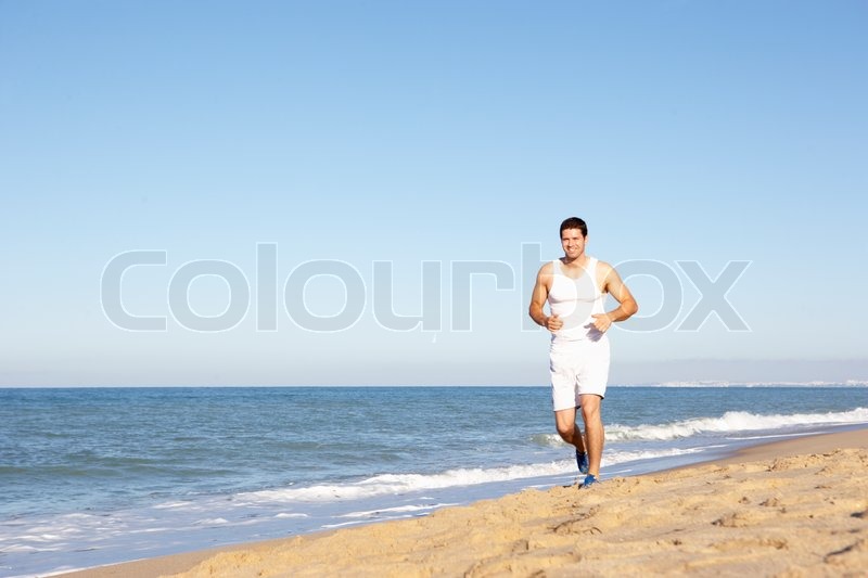 Ung mand i Fitness Tøj løber langs ... | Stock foto | Colourbox