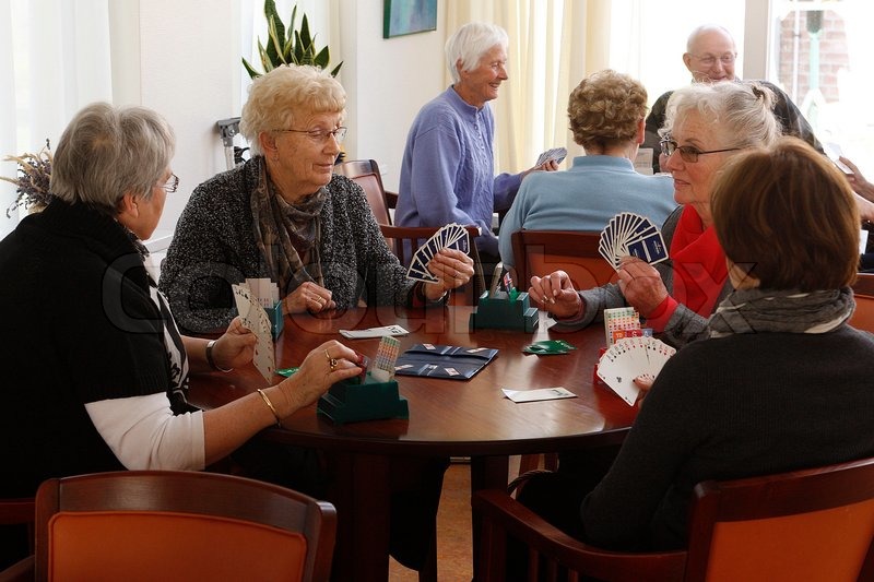 Elderly people playing cards | Stock Photo | Colourbox