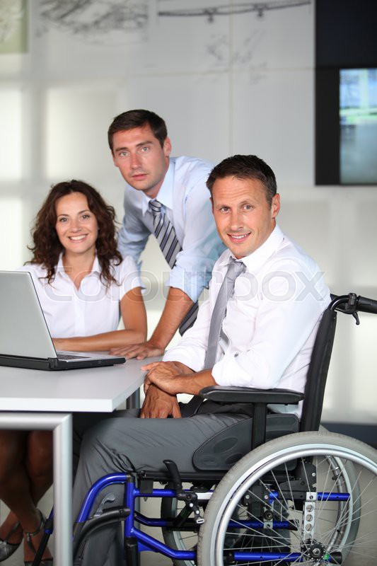 Businessman in wheelchair working in Stock image Colourbox