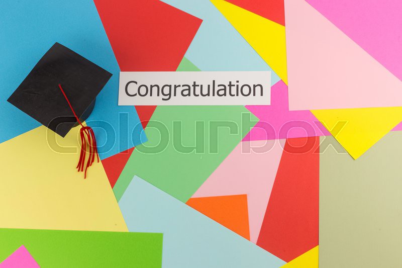 graduation cap and word congratulation on colorful paper background