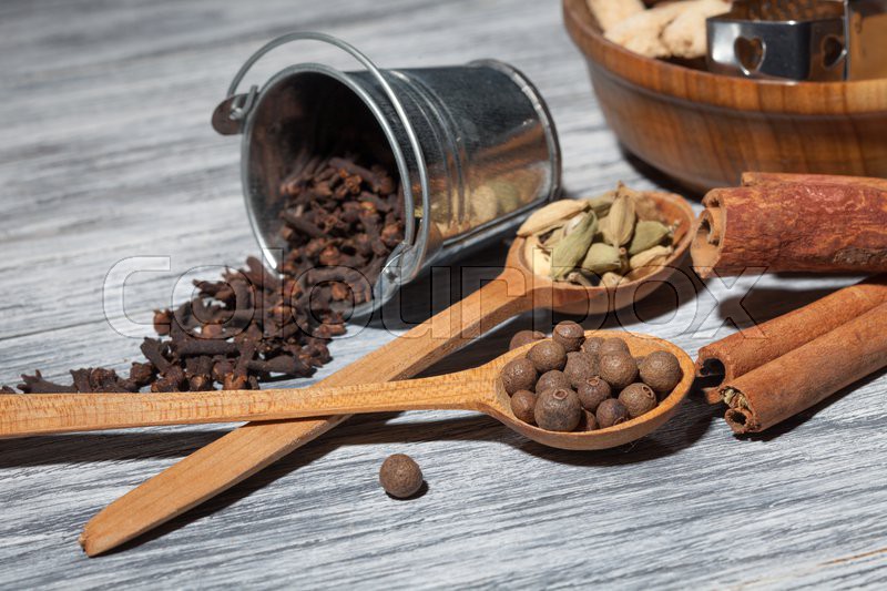 Cardamon, clove and pepper in spoons on Stock image Colourbox