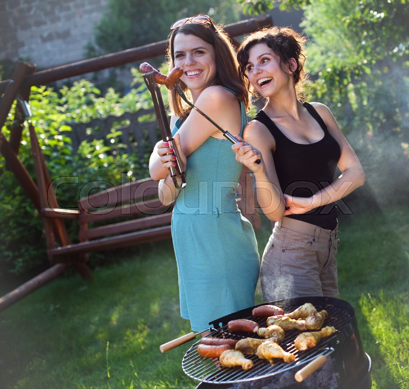 Two girls on grill, natural colorful ... | Stock image | Colourbox