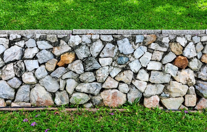 Stone wall and grass texture Stock image Colourbox