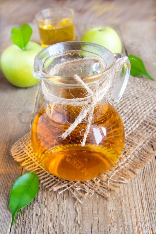 Apple juice (cider) in jug with green | Stock image | Colourbox