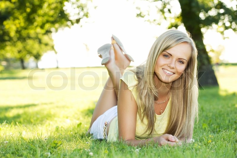 Portrait Of Young Smiling Woman In The Summer Park Stock Photo Colourbox Portrait Of Young Smiling Woman In The Summer Park Stock Photo Colourbox