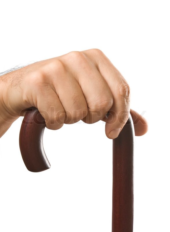Hand holds a cane isolated on white Stock Photo Colourbox