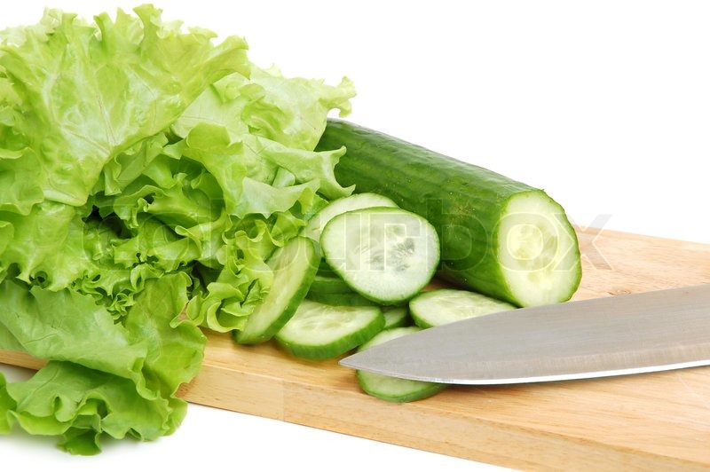 Fresh tasty lettuce and cucumber on a ... | Stock image | Colourbox