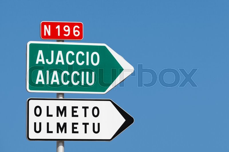 road sign white and green arrows with destination cities names and