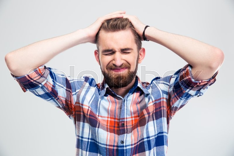 Portrait of upset young man standing ... | Stock image | Colourbox
