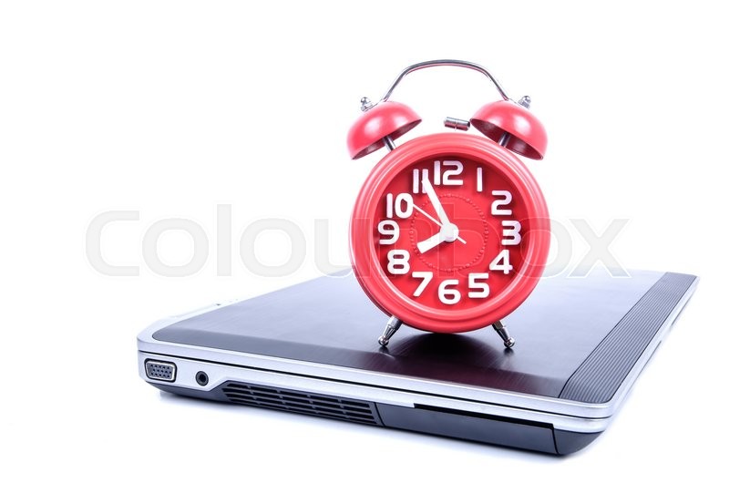 Alarm clock and laptop on white Stock image Colourbox
