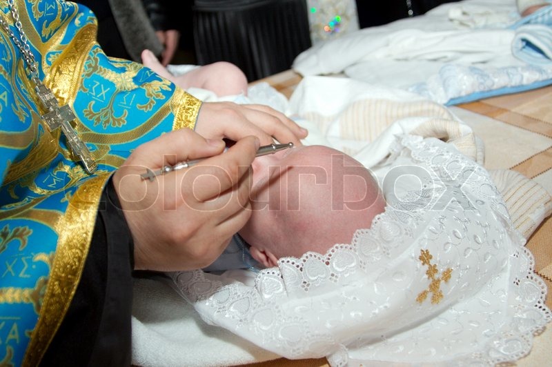 Ceremony of a christening in Christian Stock image Colourbox
