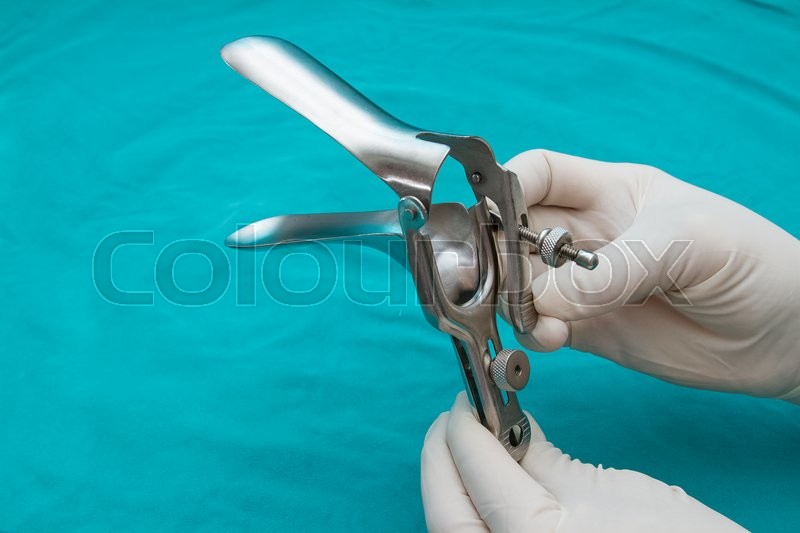 Doctor holds a disposable speculum in Stock image Colourbox