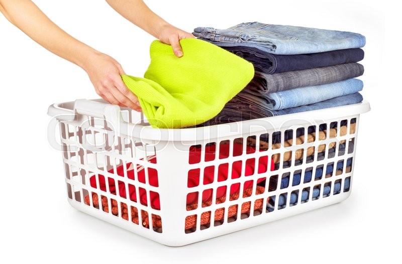 Laundry basket with folded clothes over Stock image Colourbox