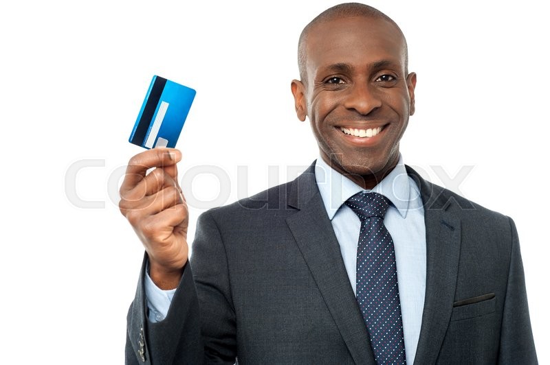 Smiling corporate guy showing credit | Stock image | Colourbox