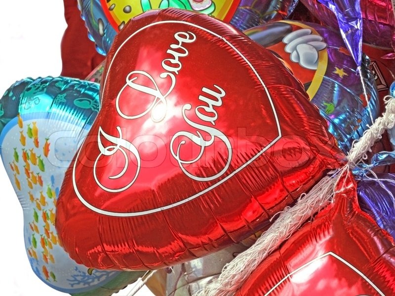 Closeup of helium filled balloons isolated Stock Photo Colourbox