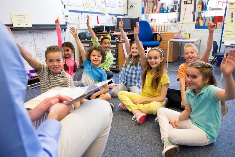 A group of children sit on the floor Stock image Colourbox