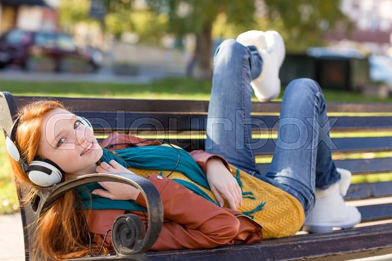 Redhead on bench share Redhead on bench