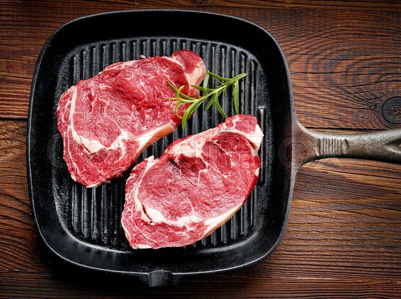 Fresh Raw Beef Steak On Black Cooking Stock Image Colourbox
