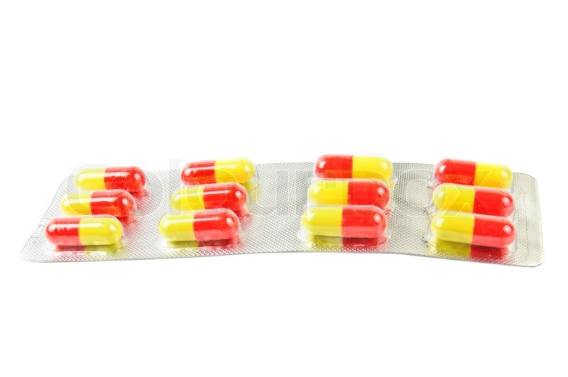 Package with yellow-red pills on the | Stock image | Colourbox