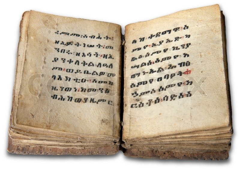 old vintage coptic holy bible opened and isolated on white stock