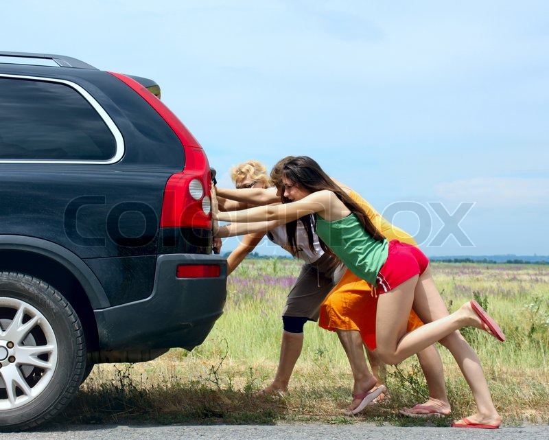 girls push along car