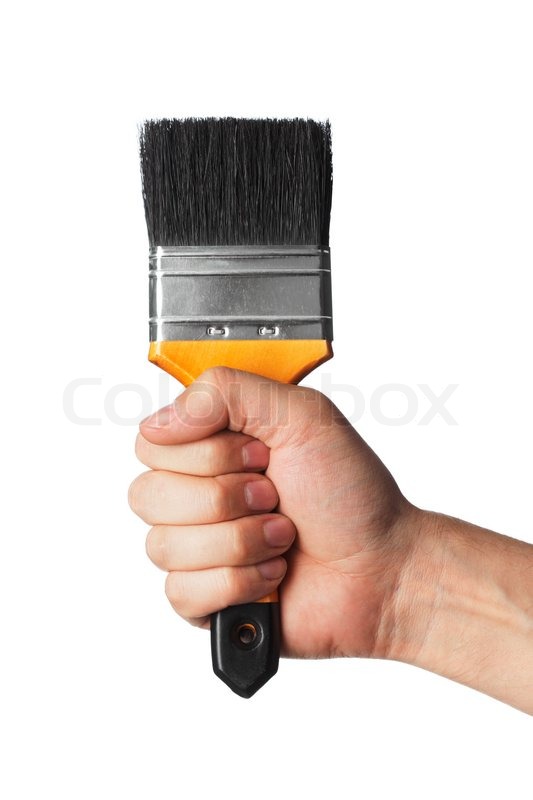Hand holding a clean new paint brush with a firm grip Stock Photo