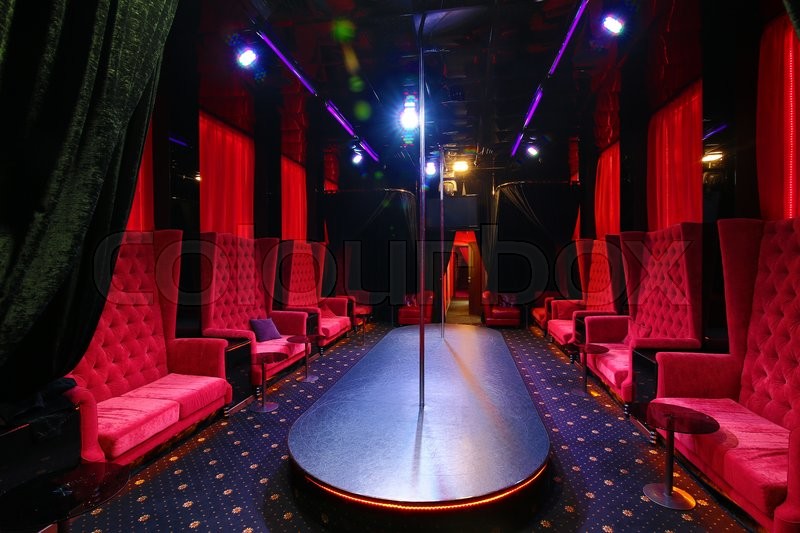 interior strip club with sofas and tables poles | Stock image | Colourbox