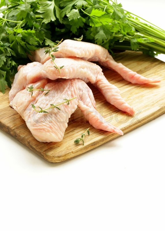 Raw chicken wings on chopping board Stock image Colourbox