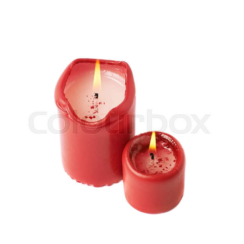 Halfburned lit red wax candle isolated Stock image Colourbox