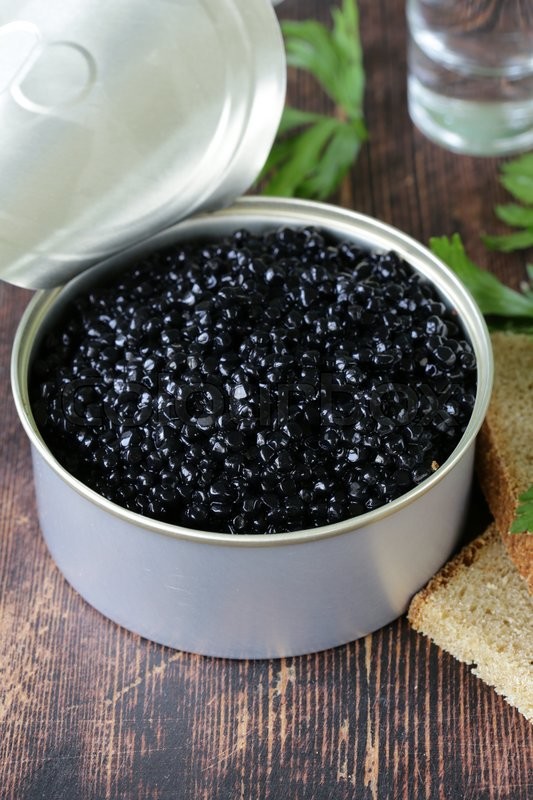 Caviar With Rye Bread And Two Shots Vodka On A Wooden Table Stock 