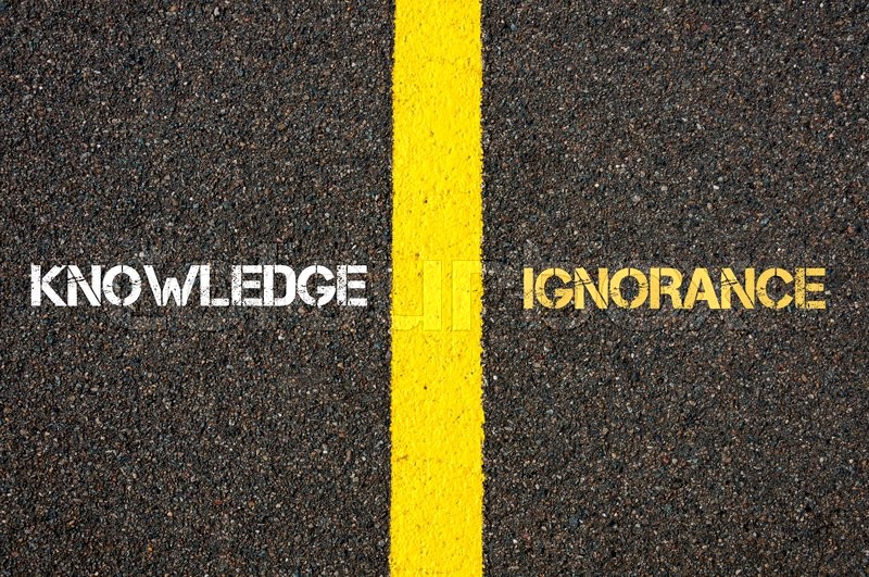 Antonym Concept Of KNOWLEDGE Versus IGNORANCE Written Over Tarmac Road