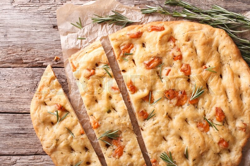 Sliced Italian focaccia with rosemary Stock image Colourbox