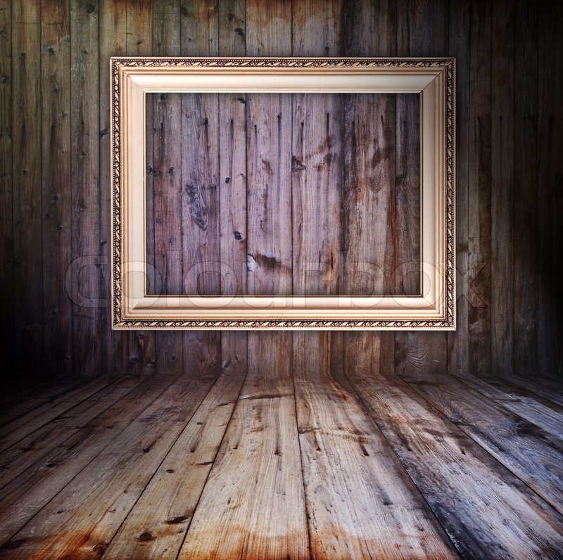 rusty vintage wooden interior with golden frame hanging on the wall