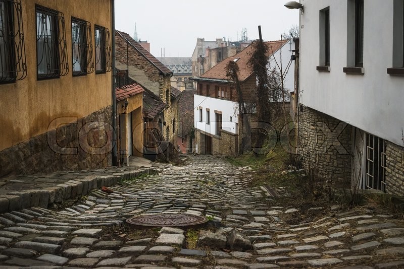 Old medieval narrow stone paved street ... | Stock image | Colourbox