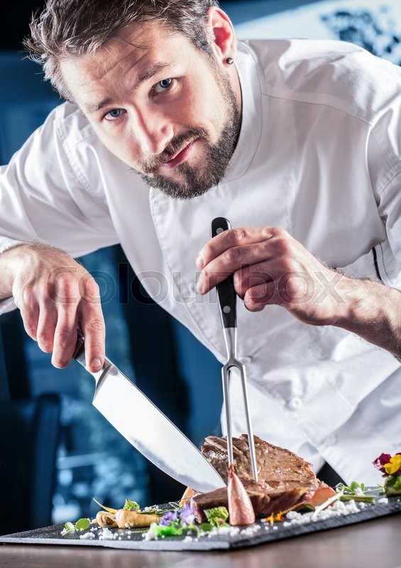 chef chef with knife and fork professional chef in a restaurant or