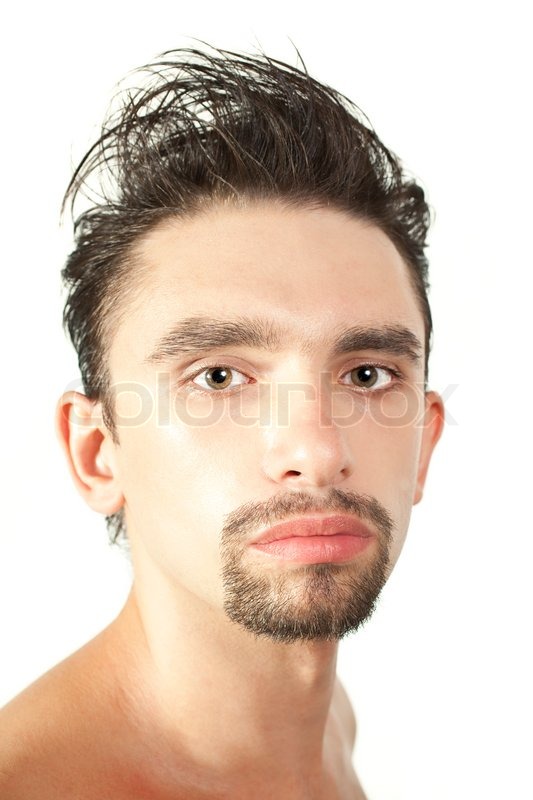 Portrait Of A Young Brunette Man With A Stylish Haircut Isolated On
