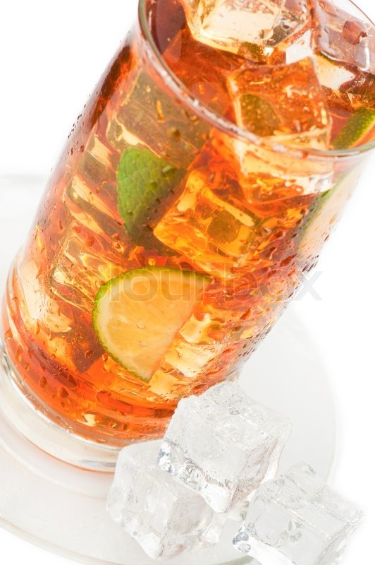 Glass of iced tea with ice cubes, lime Stock Photo Colourbox