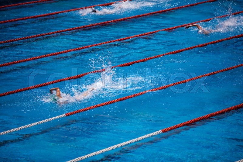 Empty Olympic Swimming Pool With Clear Blue Water And Swimmer Crawl Race Empty Olympic Swimming Pool With Clear Blue Water And Swimmer Crawl Race