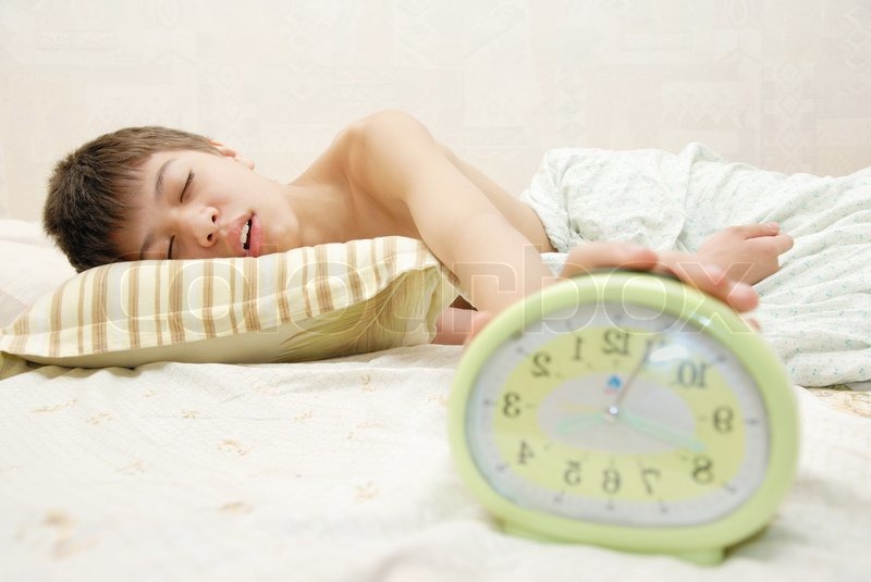 sleeping boy and alarm