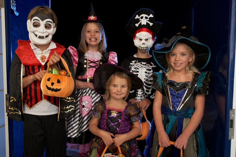 happy halloween party with children trick or treating stock photo colourbox