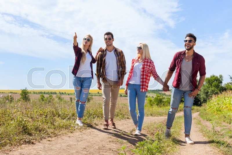 people group friends walking countryside road two couple happy smile