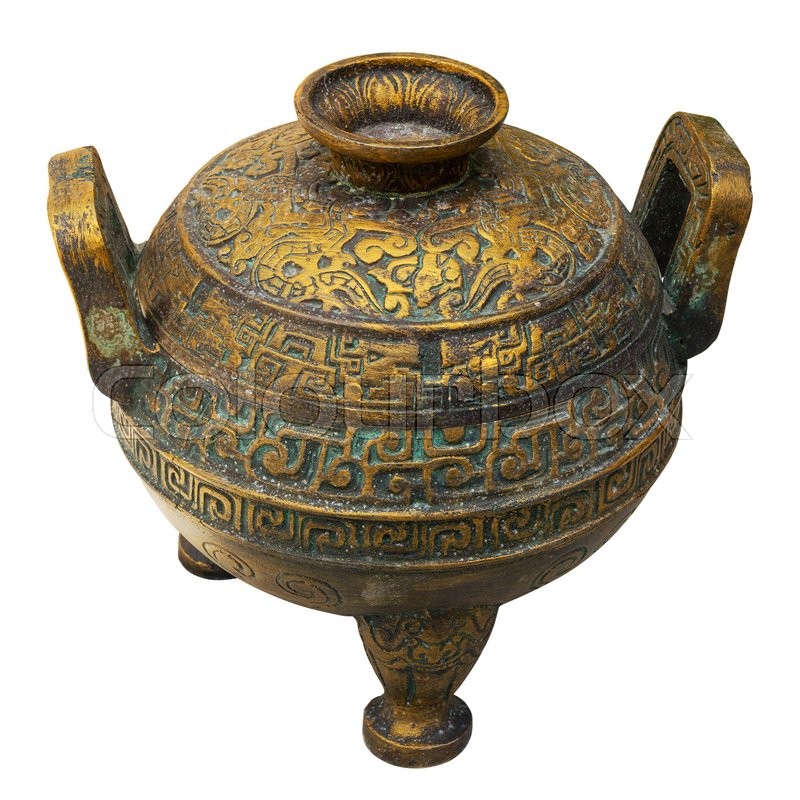 Old bronze vessel isolated on white. Stock image Colourbox